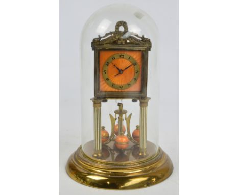 A 1930s anniversary clock with orange enamel square dial, Arabic numerals to the chapter ring and orange enamel to the sphere