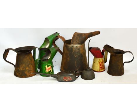 A quantity of vintage oil cans/oil dispensers to include Shell, Castrol, etc.