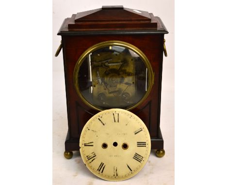 An early 19th century mahogany cased bracket clock, for restoration, the caddy top above circular dial (now unattached), insc