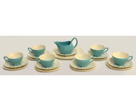 A Midwinter tea service comprising six trios, a spare saucer, a sandwich plate and a cream jug.