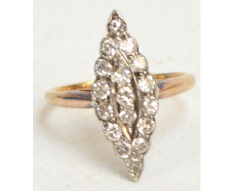An Art Deco diamond ring, the seventeen stones set in a marquise shape, on pierced gallery, size J. CONDITION REPORT: Total d
