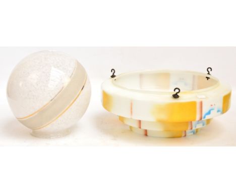 An Art Deco glass lamp shade of cylindrical stepped form with painted decoration, diameter 40cm, and a further globular glass