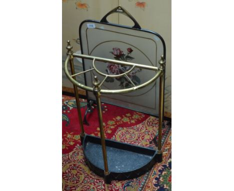 An Art Nouveau brass framed fire screen with painted milk glass panel and a brass framed stick stand (2).