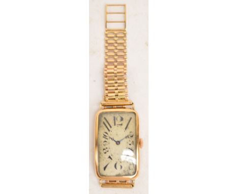 MERCER WATCH COMPANY; an 18ct gold cased Art Deco mechanical wristwatch with rounded rectangular dial set with Arabic numeral