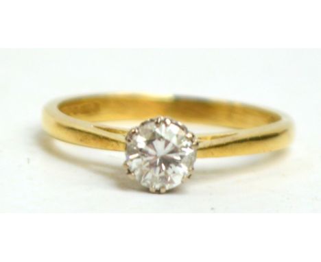 An 18ct yellow gold diamond solitaire ring, the brilliant cut stone of approx 0.33cts, size I.