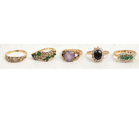 Five 9ct yellow gold dress rings, comprising two set with emerald coloured stones and a cubic zirconiums, one sapphire and cu