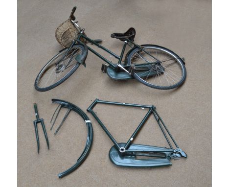 A vintage "The All-Steel Bicycle", with Brooks saddle and interchangeable male/female frame.