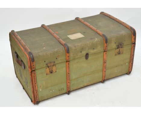 A large vintage wooden bound travelling trunk.