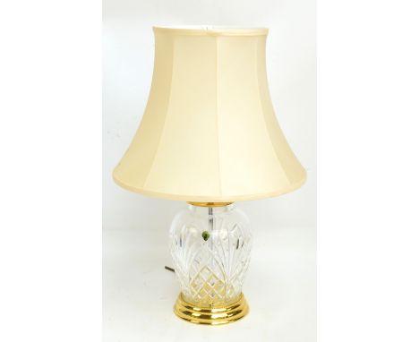 A Waterford Crystal clear cut glass lamp base of baluster form with brass fittings, height 29cm..