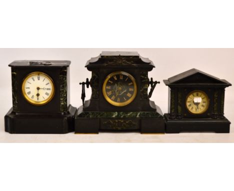 A late 19th century French black slate mantel clock with white enamel dial set with Roman numerals, a further green marble an