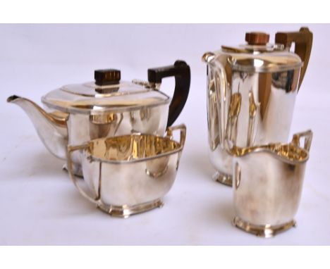 An Edward VIII/George VI hallmarked silver matched four piece tea service of rounded rectangular form with stepped base and f