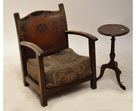 An oak Arts and Crafts low elbow chair with leather back panel, and a reproduction mahogany tripod wine table (2).