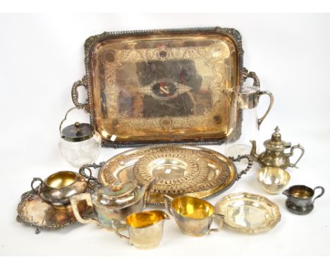 A quantity of silver plated items including a large twin handled tray, other trays, a tea service, jugs, etc.