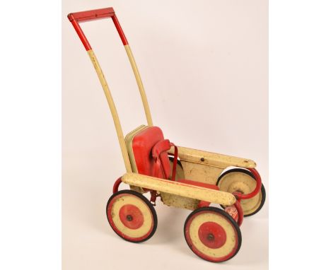 A 1950s Mobo Magic child's dolls stroller with left/right mechanism to the bar and voice box to the padded back.