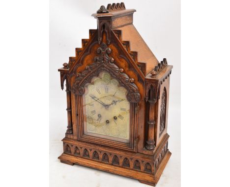 A Victorian Gothic oak bracket clock, the arched case with engraved dial inscribed "Edwards, Northwich 1880", with eight day 