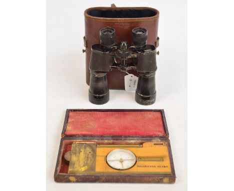 A cased early 20th century wood and brass clinometer with protractor, compass, and two spirit levels stamped "Davis & Son, De