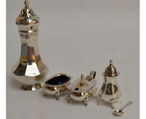 A George V hallmarked silver sugar shaker of octagonal baluster form with domed pierced cover and cast finial, Adie Bros, Bir