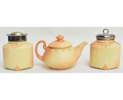 A Locke & Co. blush ivory teapot with gilt heightened foliate decoration, shape 271, with black stamp to base, height 12cm, a