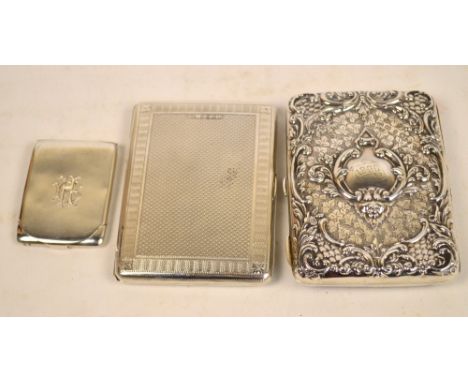 A late Victorian hallmarked silver notebook with embossed and engraved cover bearing initials dated 1900 and with ivory and l