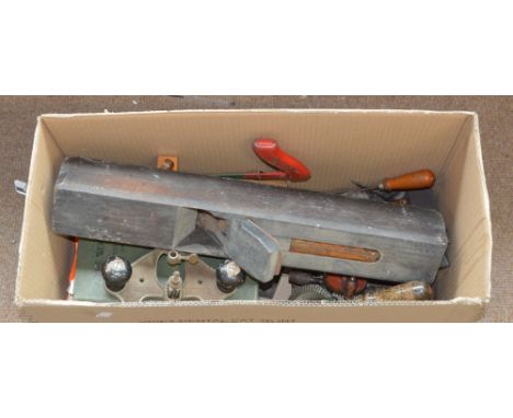 A small quantity of woodworking tools to include planes, drill, and books relating to woodworking.
