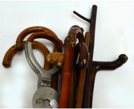 An Edwardian bamboo walking cane with silver mount engraved "E. Haymer", hallmarked for Birmingham 1911, length 88cm, a colle