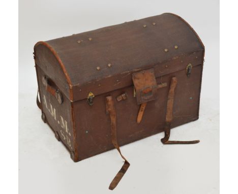 A canvas covered domed travelling chest with leather corners, straps and handles, retailed by Finnigans Ltd, Deansgate and Ma