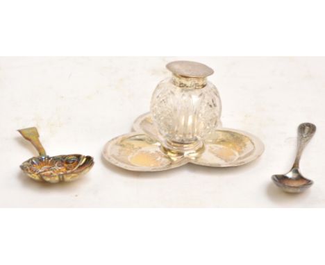 An Edward VII hallmarked silver and cut glass spherical inkwell, on silver trefoil base, the base hallmarked for Birmingham 1