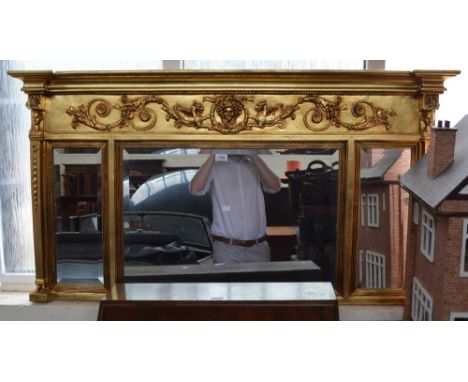 A modern decorative gilt framed over mantel mirror.