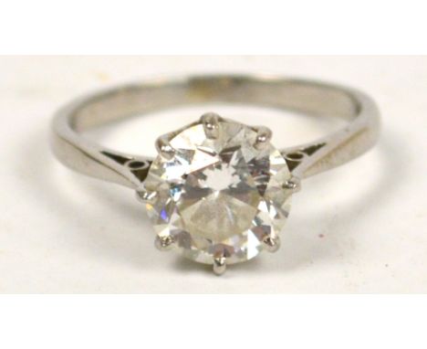 A platinum diamond solitaire ring, the claw set brilliant cut stone weighting approx 1.95cts, H+, SI1, in pierced shoulders, 