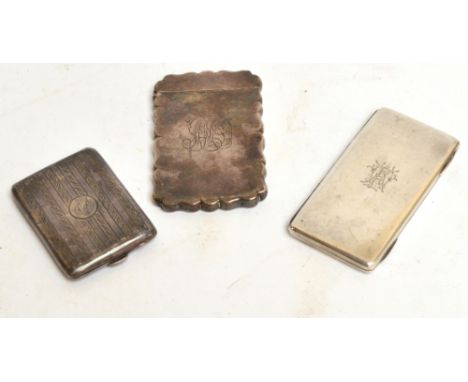 A Victorian hallmarked silver flat shaped card case with hinged lid and monogram, Deakin & Francis, Birmingham 1886, another 