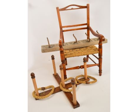 A child's stained beach elbow chair with ring turned supports and stretchers and rush seat and a large set of flower carved c