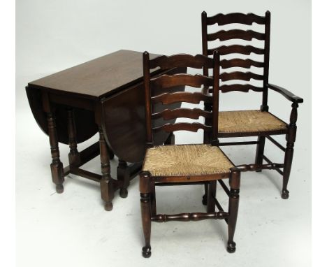 An oak dropleaf table and five ladder back chairs (4+1) (6).