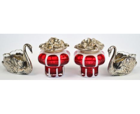 A pair of German 900 grade silver open salts in the form of swans with clear glass fluted edged liners, length 7cm, and a pai