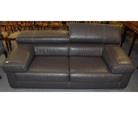 A grey leather two seater sofa with adjustable headrests