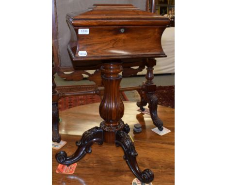 A Victorian rosewood teapoy, with caddy top, baluster standard and scroll carved legs (empty), 79cm high 
