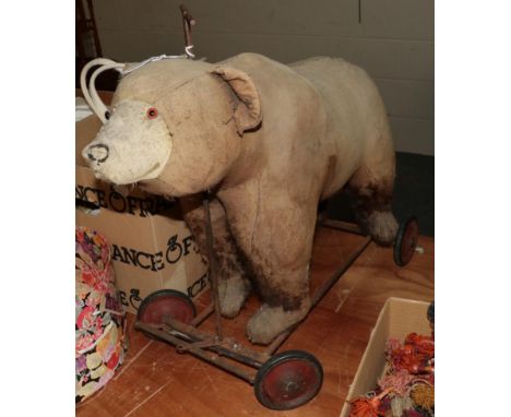 A Steiff brown bear on wheels (a.f.) 