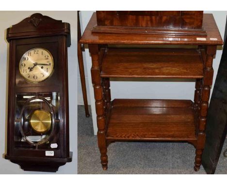 An oak two tier occasional table and a Art Deco striking wall clock 