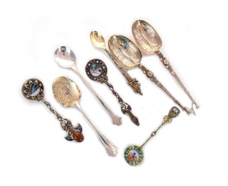 THREE SILVER GILT AND ENAMEL SPOONS LATE 19TH / EARLY 20TH CENTURY 800 standard, possibly Egyptian, the first with amber scar