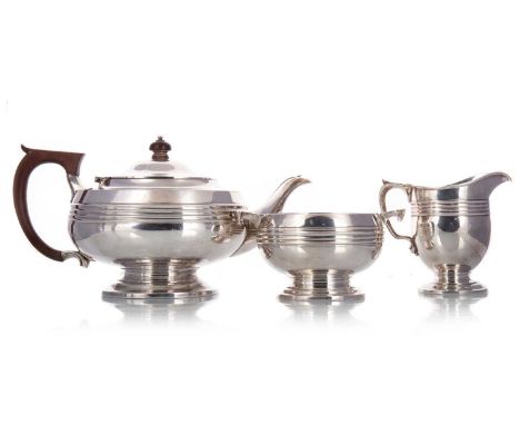 GEORGE V SILVER THREE-PIECE TEA SERVICE JAMES DEAKIN & SON, SHEFFIELD 1926 comprising teapot, sugar bowl and cream jug, of Ar