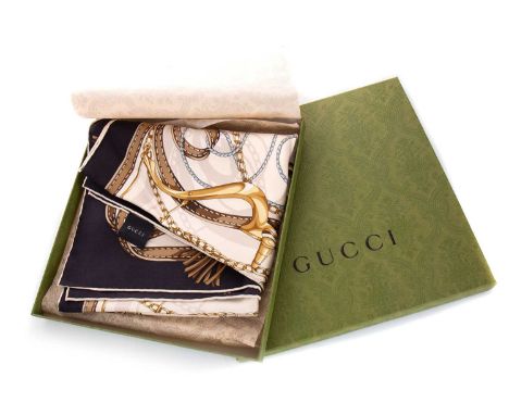 GUCCI,  SILK SCARF in a black, white and gold colourway, housed in a green Gucci boxCondition generally good. One small mark,