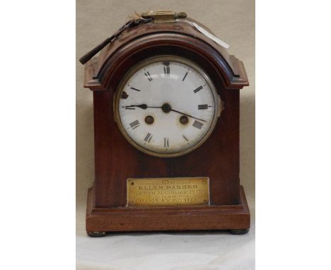 A wooden cased eight-day mantel clock with a brass plaque inscribed "To Ellen Parker" on her Marriage 1915, From MAJOR A. V. 