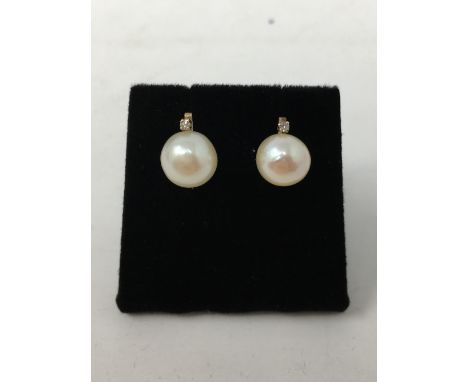 A pair of 14ct gold, cultured pearl and diamond earrings.