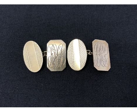 A pair of 9ct gold cufflinks with engine turned decoration. Approximate weight 7 grams.