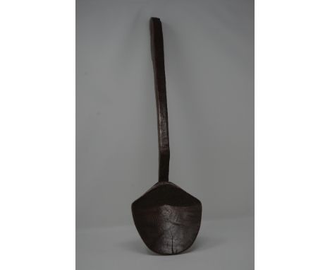 A North American treen ceremonial ladle with hippocampus handle, possibly cherry wood.