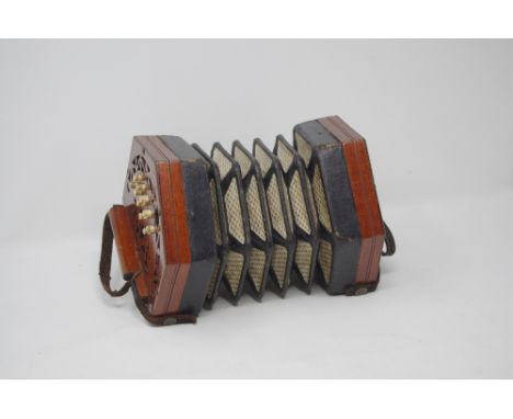 A 22 button (in total) Lachenal and Co. London Patent concertina No. 114462, with original wooden travelling case.