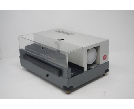A Leitz projector and a mini Minolta 35 slide projector.