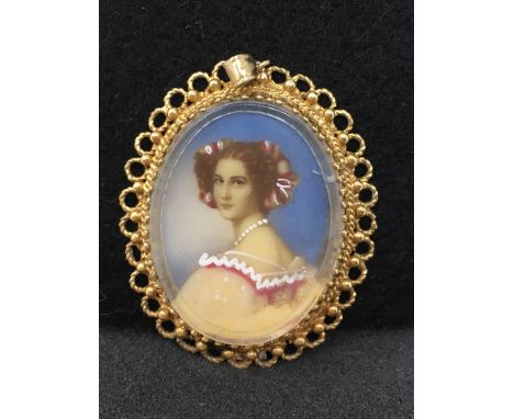 A 19th Century style gold (unmarked) portrait miniature of a lady pendant. Total weight approximately 10.0 grams.