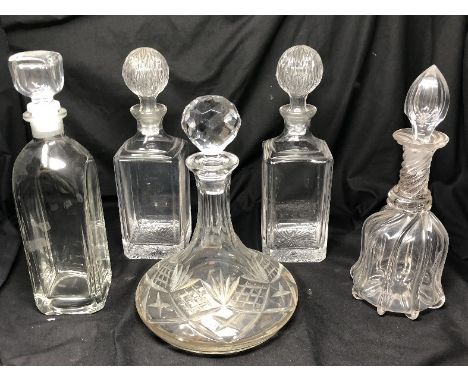 Six assorted glass decanters including a ship's decanter.