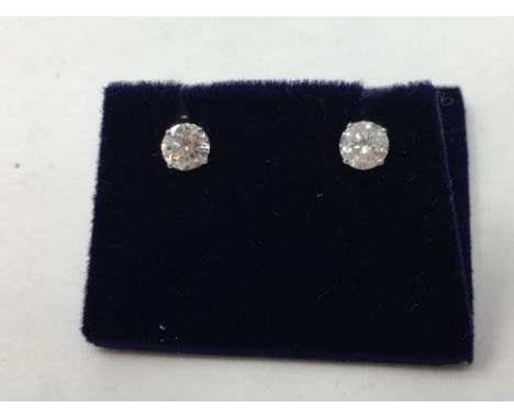 A pair of white gold and diamond stud earrings, approximately 1ct.