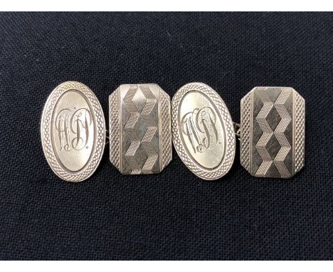 A pair of 9ct gold cufflinks with engine turned decoration. Approximate weight 4.4 grams.